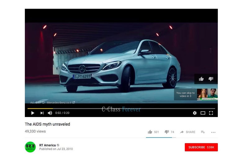 YouTube screenshot showing Mercedes-Benz commercial playing before an AIDS conspiracy video from RT America.