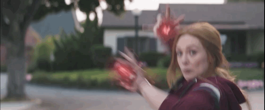 Scarlet Witch shoots red magic lightning lasers at Agatha.