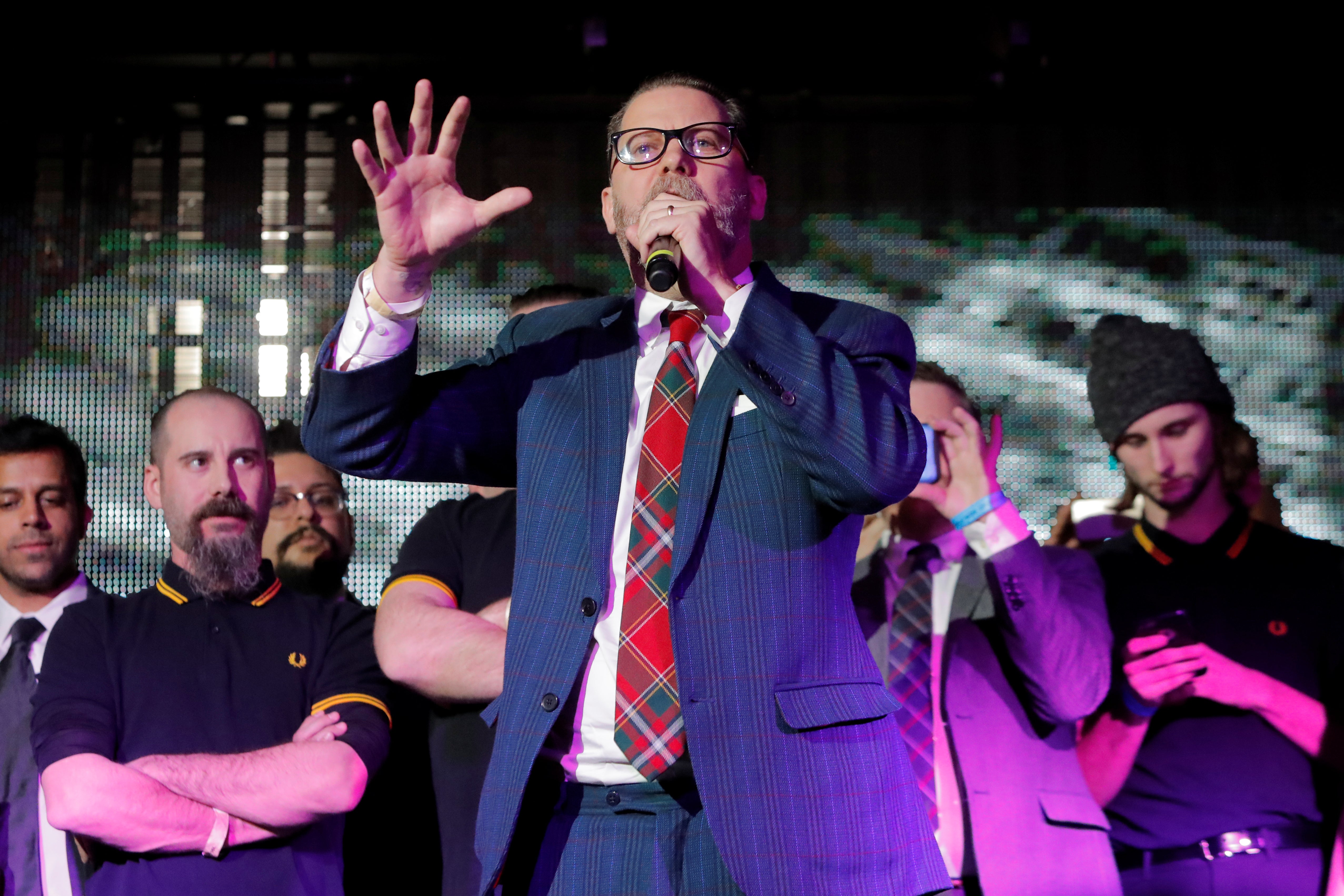 Vice magazine co-founder Gavin McInnes speaks on stage with members of the Proud Boys organization at the "A Night for Freedom" event organized by Mike Cernovich in Manhattan on January 20, 2018. 