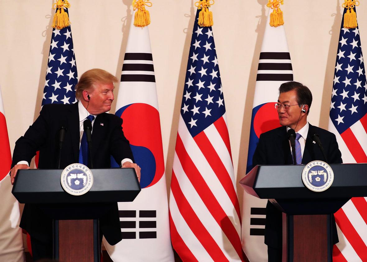 U.S. President Donald Trump talks with South Korean President Moon Jae-In