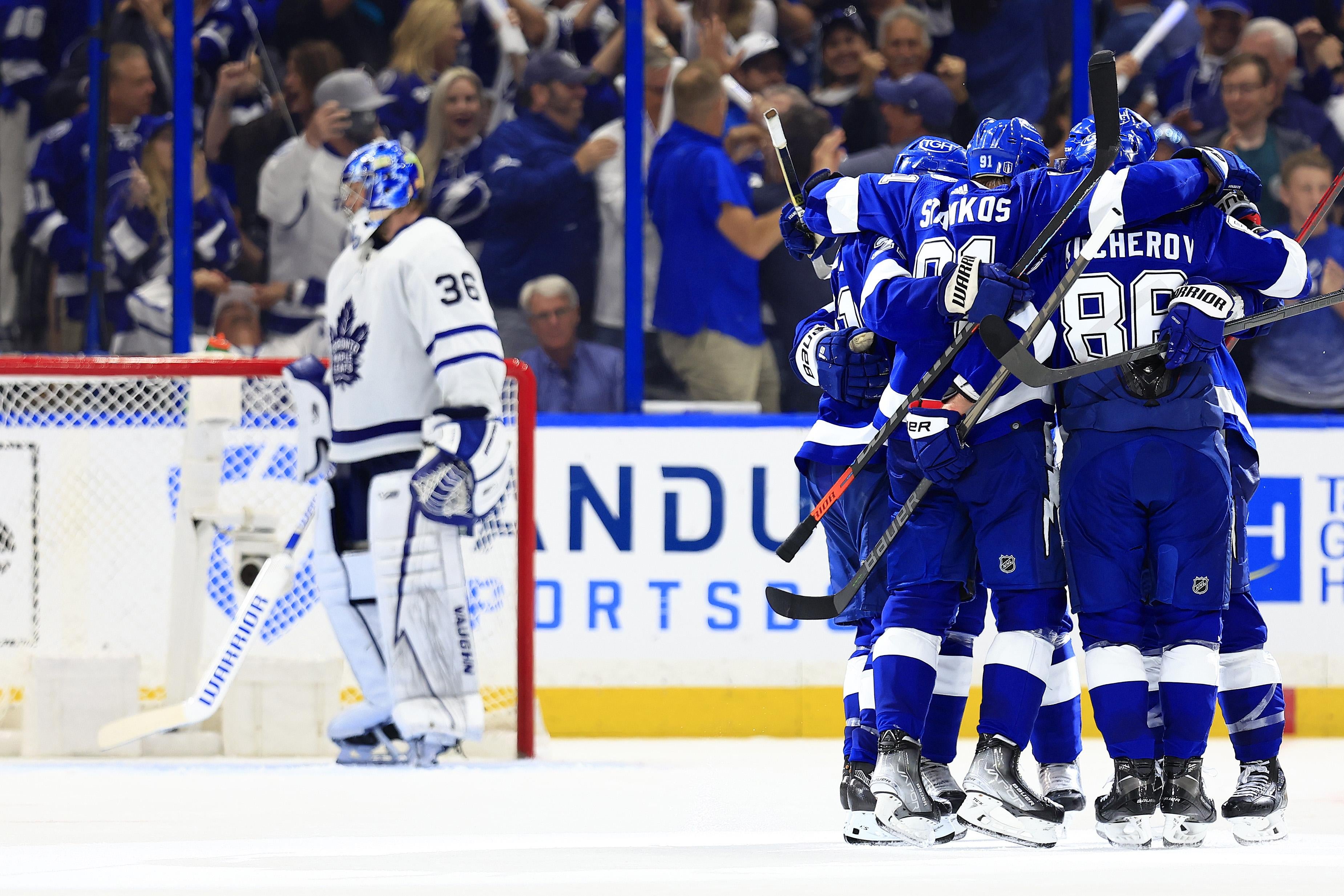 A hockey team celebrates a goal.