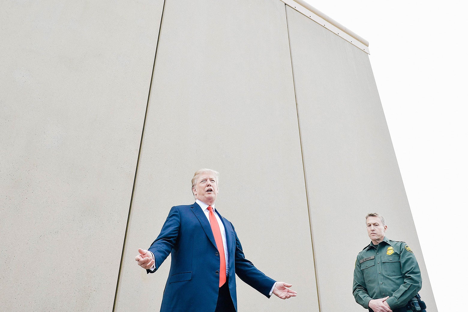 President Donald Trump inspects border wall prototypes with Chief Patrol Agent Rodney S. Scott in San Diego, California, on March 13.