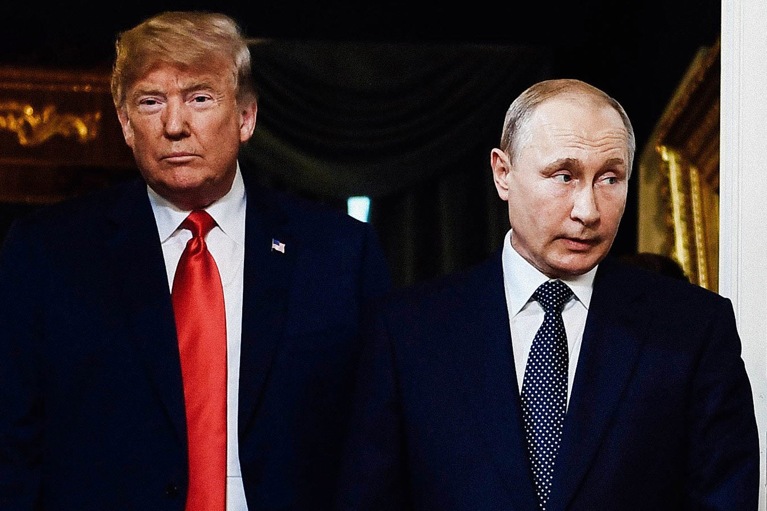 Donald Trump looks straight ahead, and Putin looks off to the side.
