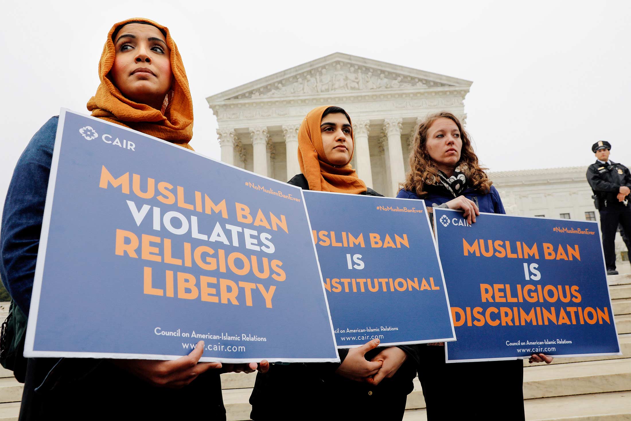 Female protesters standing in front of the Supreme Court.