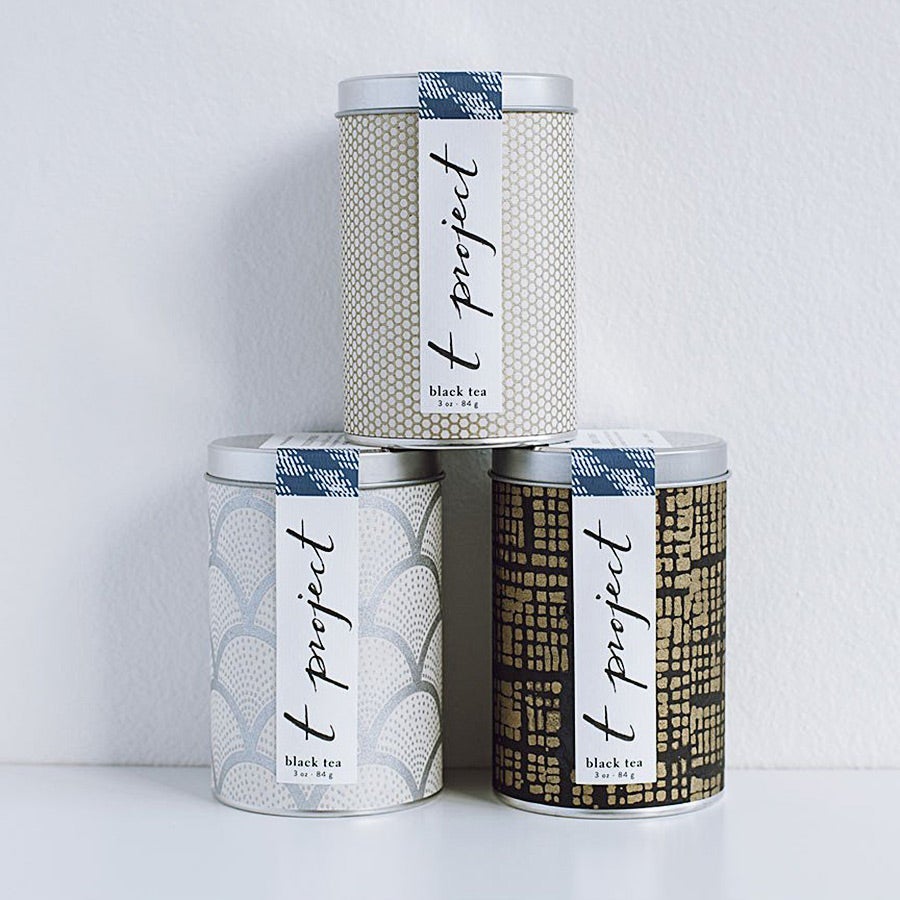 Three canisters of tea