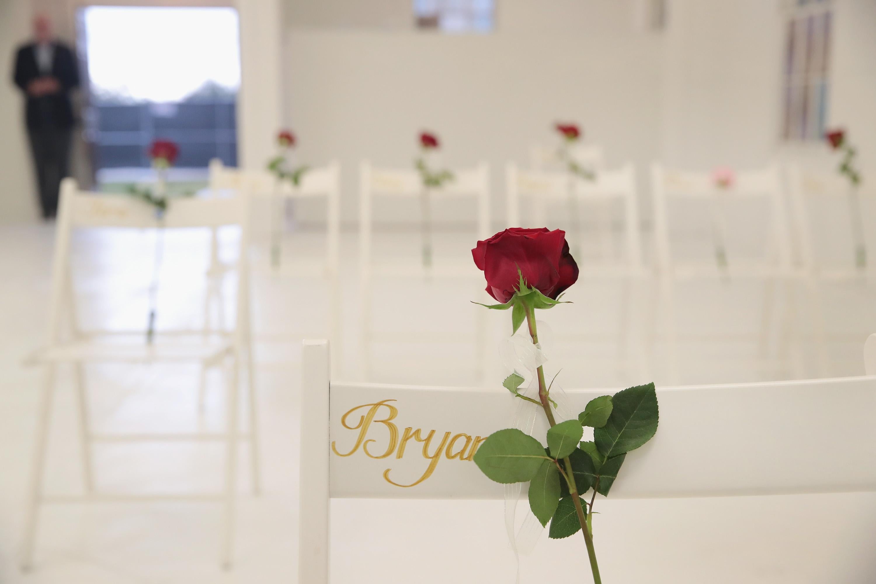 SUTHERLAND SPRINGS, TX - NOVEMBER 12:  The First Baptist Church of Sutherland Springs is turned into a memorial to honor those who died on November 12, 2017 in Sutherland Springs, Texas. The inside of the church has been painted white with 26 white chairs placed around the room. On each chair is a single rose and the name of a shooting victim. The chairs are placed throughout the room at the location where the victim died. The memorial will be open to the public. Devin Patrick Kelley shot and killed the 26 people and wounded 20 others when he opened fire during Sunday service at the church on November 5th.  (Photo by Scott Olson/Getty Images)