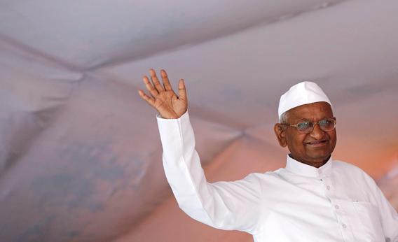 Veteran Indian social activist Anna Hazare waves to his supporters.