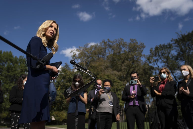 McEnany, maskless, speaking with masked reporters.
