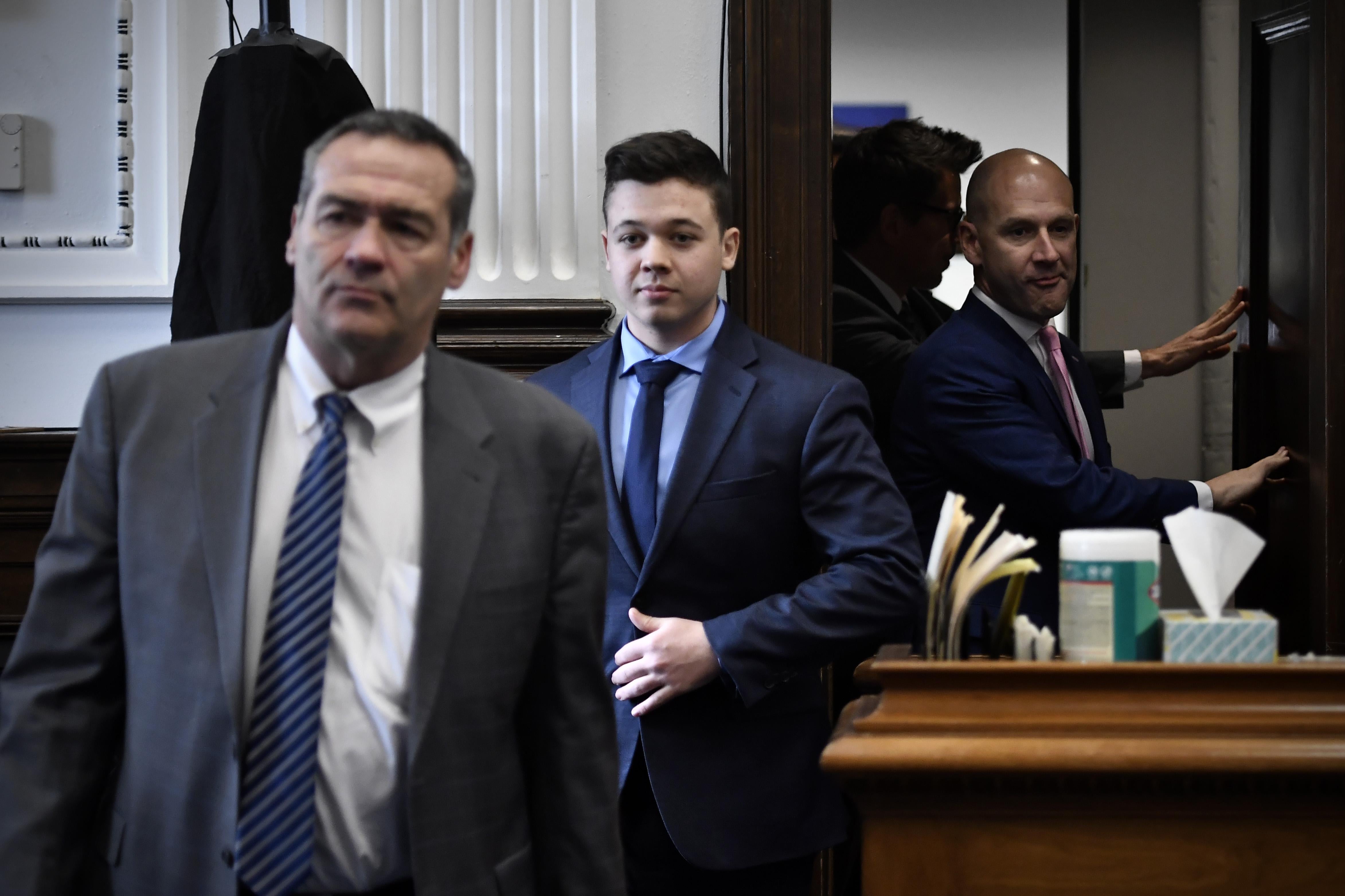 Kyle Rittenhouse enters the courtroom with his attorneys Mark Richards (left) and Corey Chirafisi for a meeting called by Judge Bruce Schroeder at the Kenosha County Courthouse on November 18, 2021 in Kenosha, Wisconsin.
