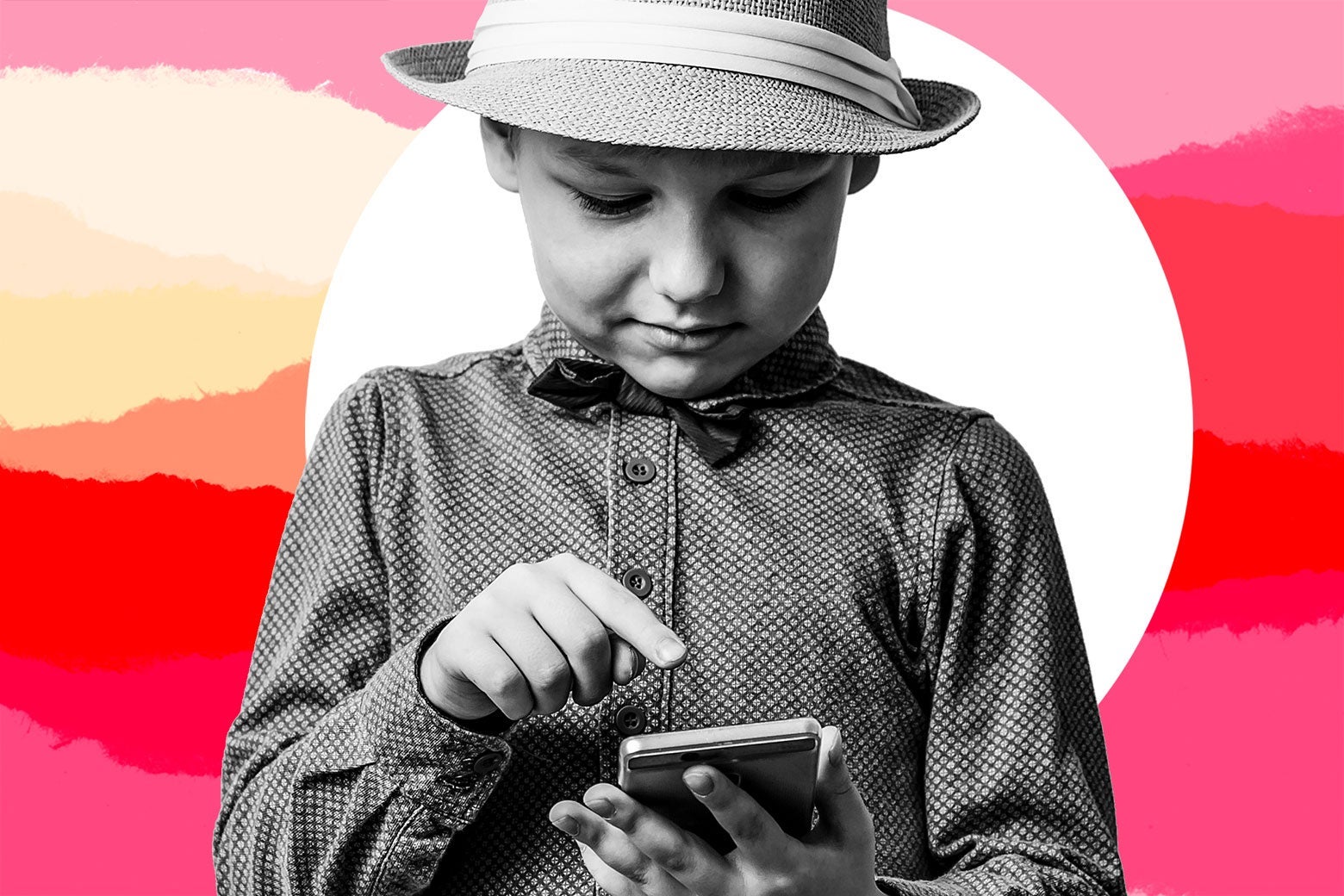 A kid in a hat and buttoned-up shirt points a finger at his cellphone.