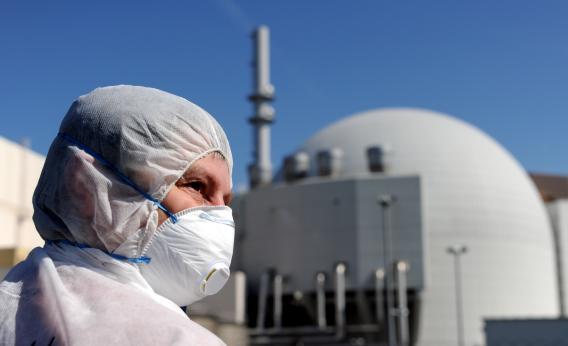 A protester wearing a mask stands in front of the nuclear power plant in Brokdorf, northern Germany, on April 21, 2013.