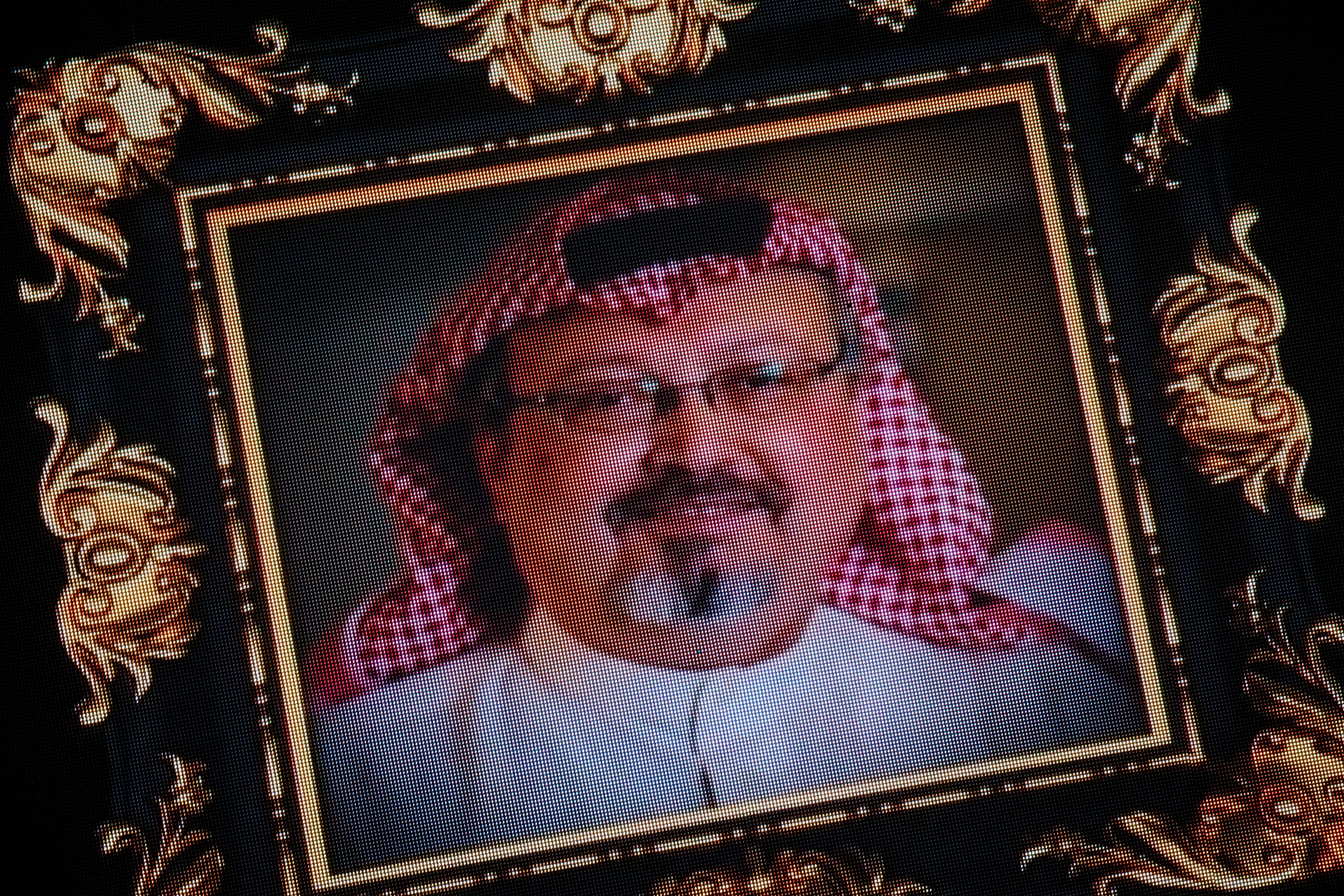 An image of Khashoggi in an ornate frame, projected on a screen.
