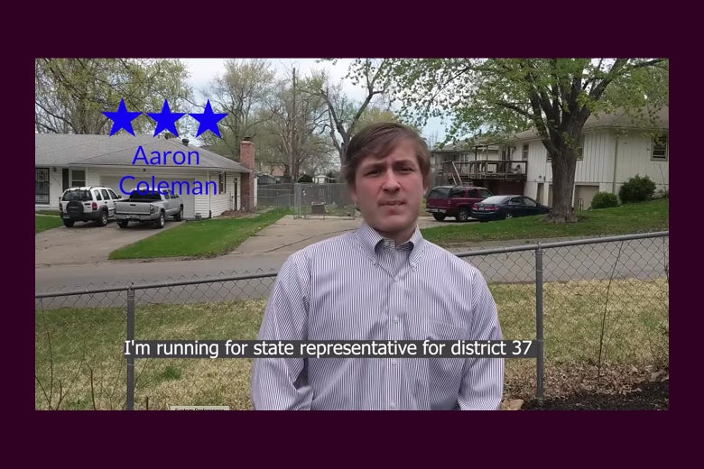 In a campaign video still, Aaron Coleman, wearing a button-down shirt, stands in front of a chain-link fence in a residential neighborhood. 