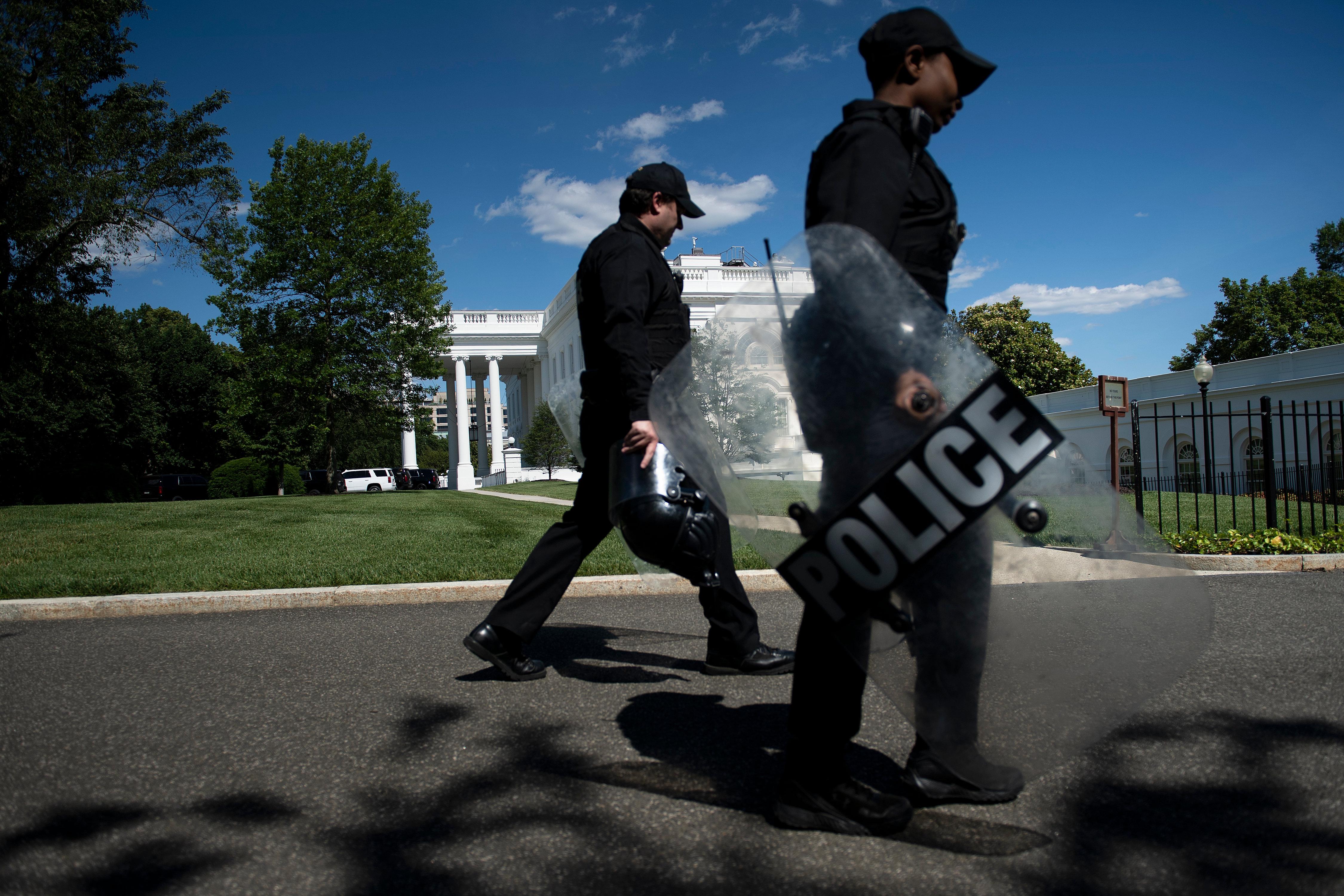 Members of the Secret Service walk past the White House as protests over the death of George Floyd continue on June 1, 2020, in Washington, D.C.