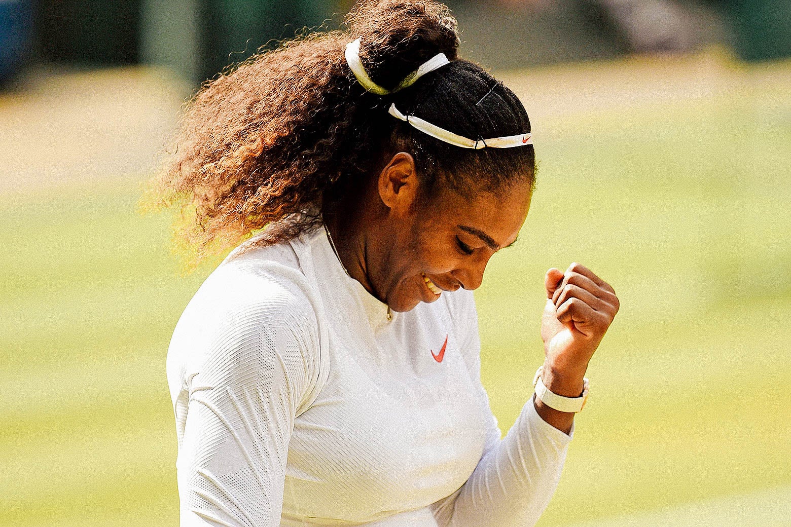 Serena Williams pumps her fist at Wimbledon.