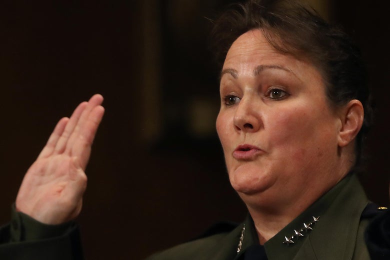 Carla Provost raises her hand to be sworn in.