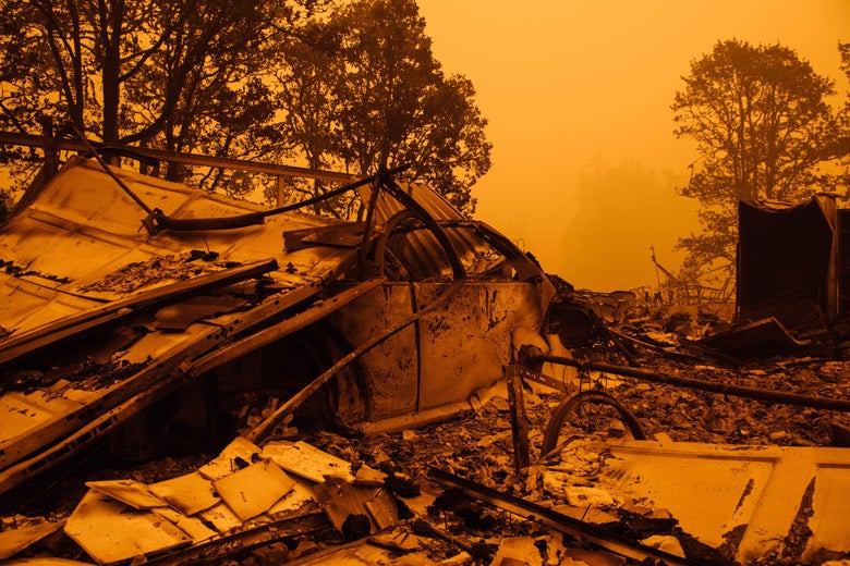 An orange, smoke-filled sky and burnt remains