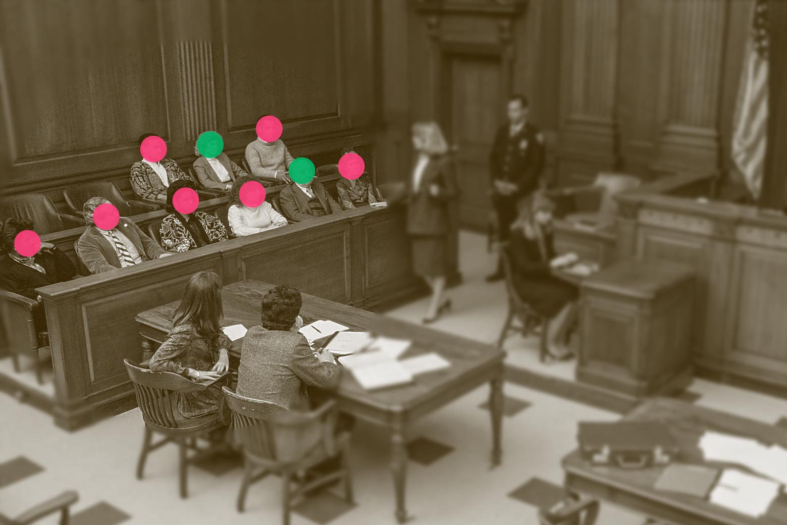An overhead view of a courtroom in session is seen, with the jury members' faces cut out. Two people sit on a table while a woman talks to the jury. A person stands behind her and near another woman at a desk.
