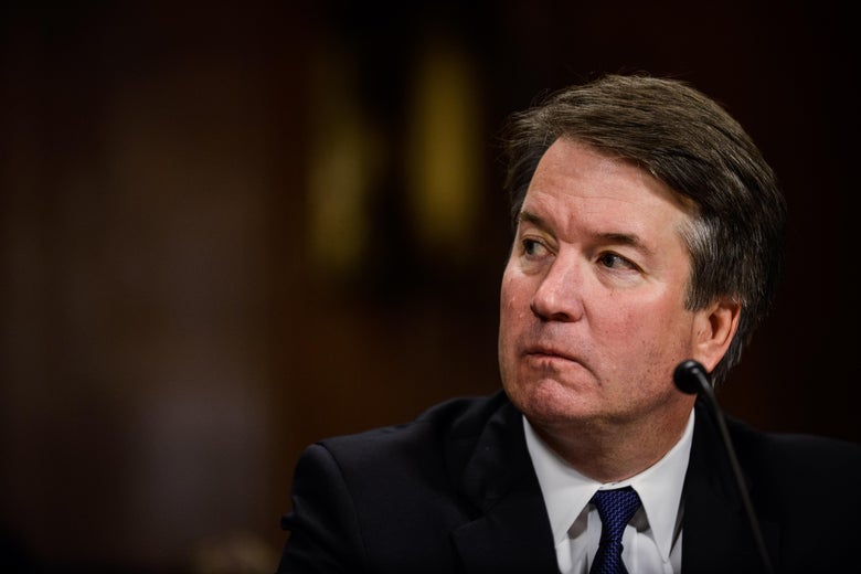 Kavanaugh looks off to the side thoughtfully, or in frustration, as he sits before the committee.