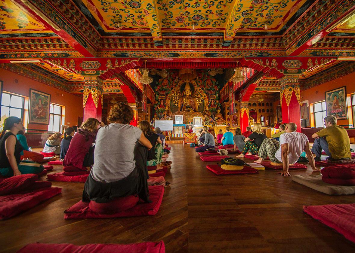 At Kopan Monastery, in the northern outskirts of Kathmandu, tourists listen to a monk explain the finer points of meditation and Tibetan Buddhism. 
