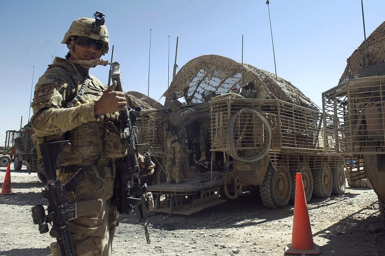 A soldier attached to the 2nd platoon, C-Coy. 1-23 infantry based at Zangabad forward operating base in Panjwai District, Afghanistan, gestures on Sept. 22, 2012.