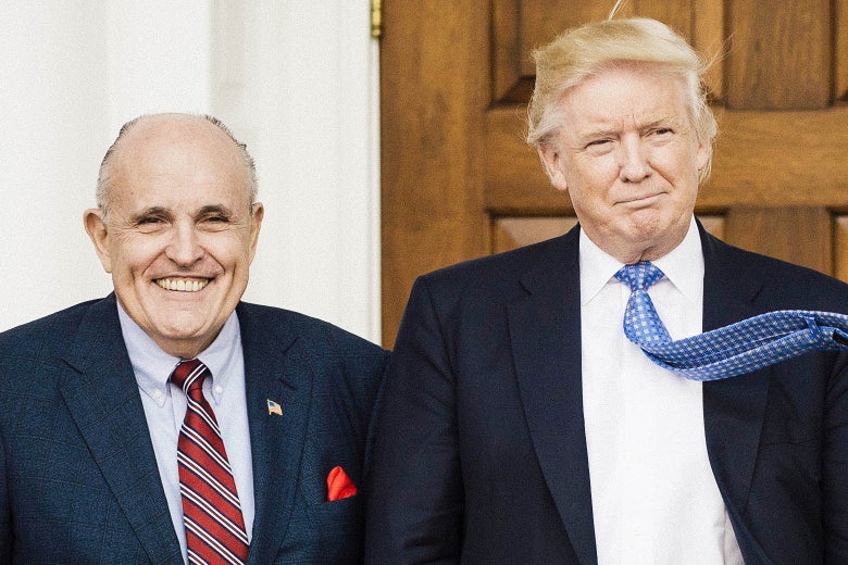 Rudy Giuliani and Donald Trump smile for a camera.