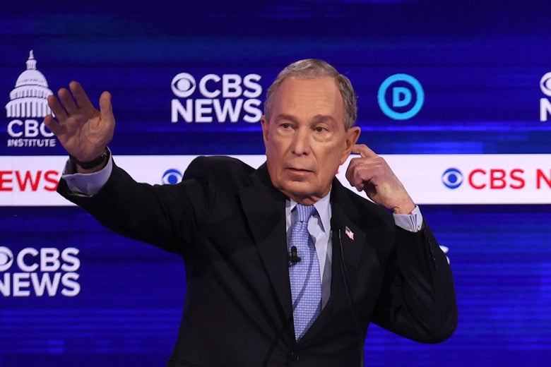 Mike Bloomberg holds a hand to his ear during the South Carolina debate.