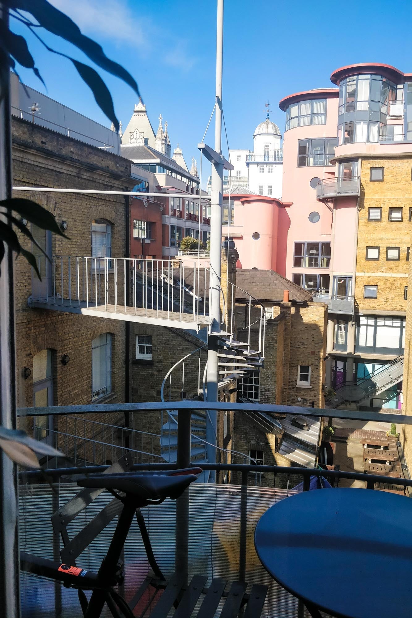 View from an apartment patio onto apartment buildings nearby.