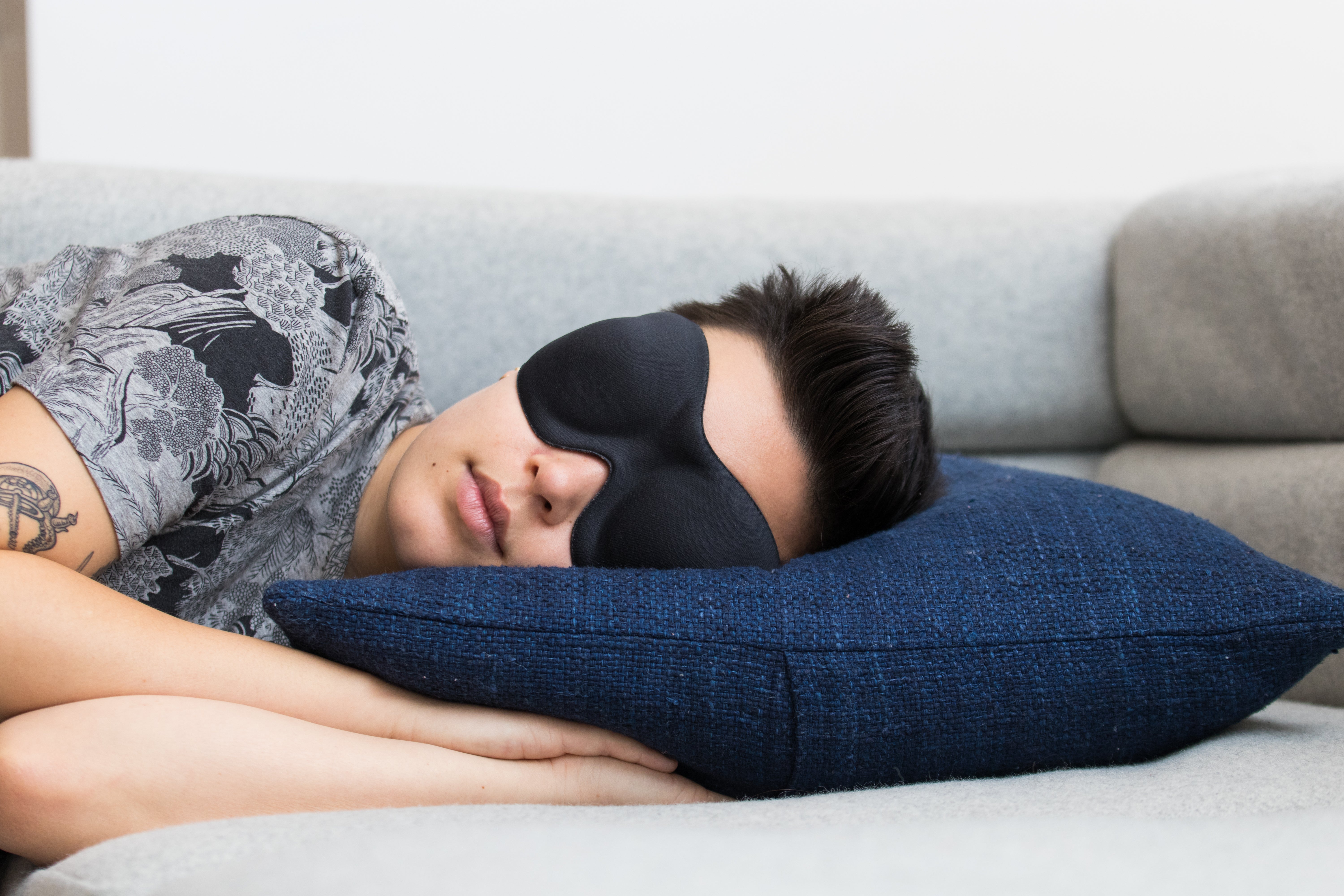person sleeping in an eye mask