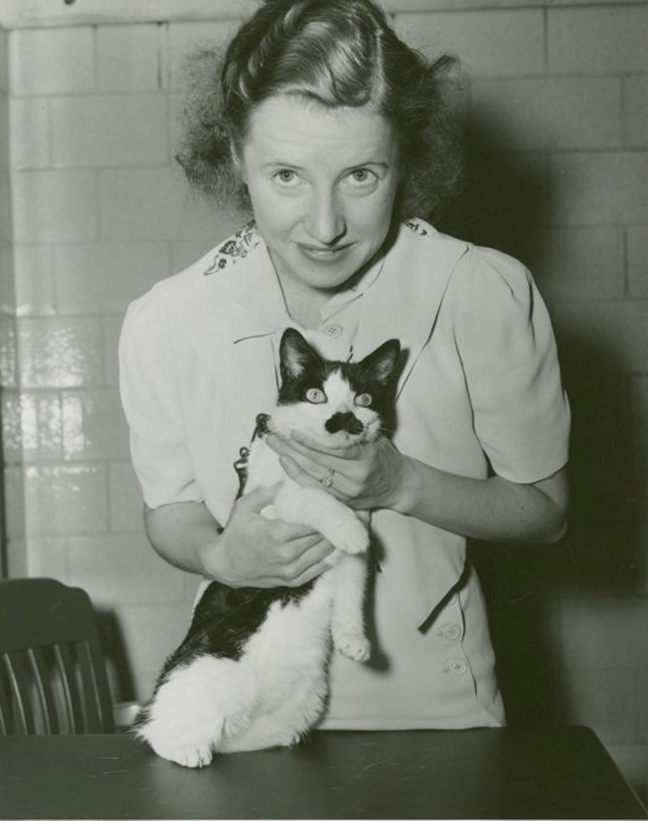 Woman holding Hitler the Cat at Jitterbug Contest.