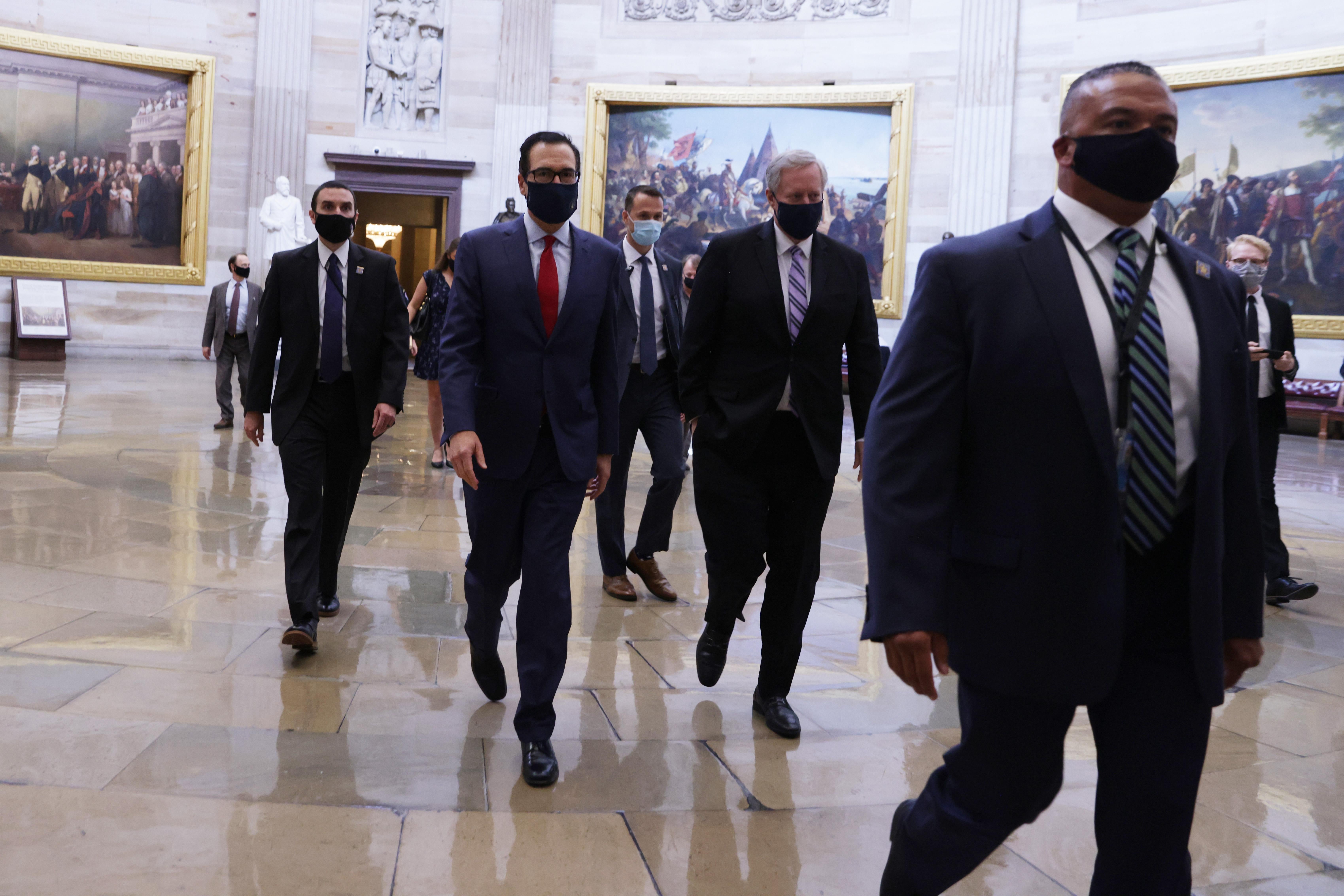 Mnuchin and Meadows walk through the Capitol.