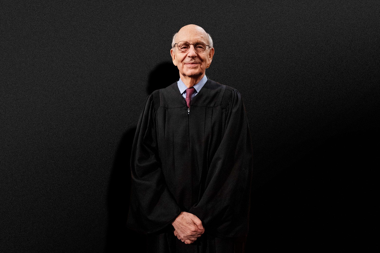 Stephen Breyer standing while wearing Supreme Court robes