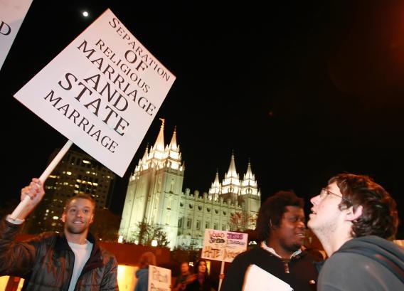Jay Christian, left, and thousands of other people protest against the passage of California's Proposition 8 outside the world headquarters of Temple of the Church of Jesus Christ of Latter Day Saints.
