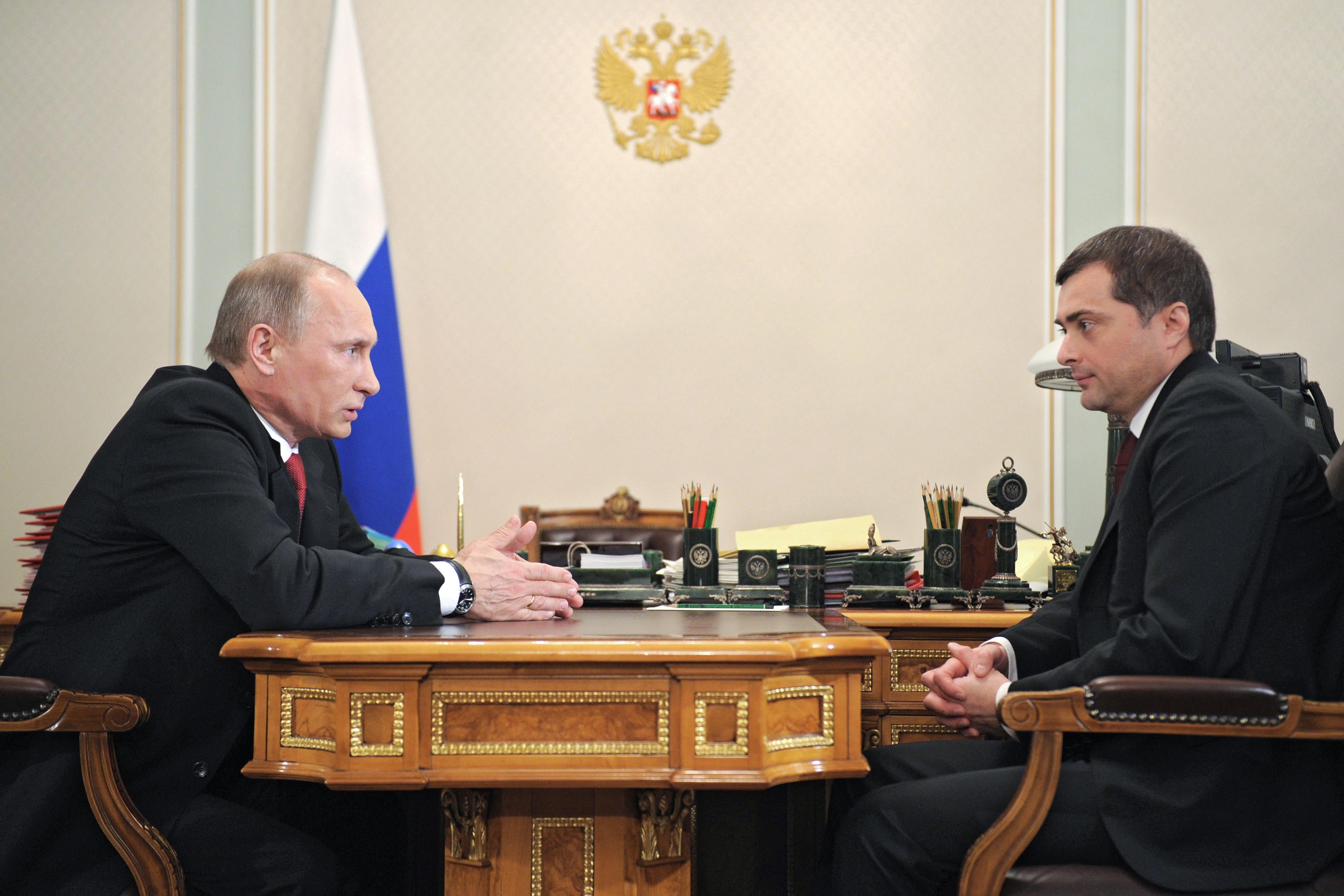 Russia's Prime Minister Vladimir Putin (L) speaks with former Kremlin first deputy chief of staff, Vladislav Surkov,  during their meeting in Putin's Novo-Ogaryovo residence outside Moscow, on December 30, 2011. The Kremlin announced  earlier this week that Surkov, the man credited with designing Russia's tightly-controlled political system, was leaving his job as deputy Kremlin chief of staff and would take charge of economic modernisation. Russian newspapers reported that Putin was personally responsible for the sidelining Surkov, who designed Russia's tightly-controlled politics and did not avert this month mass protests over disputed parliamentary elections. AFP PHOTO/ RIA-NOVOSTI/ ALEXEY DRUZHININ (Photo credit should read ALEXEY DRUZHININ/AFP/Getty Images)