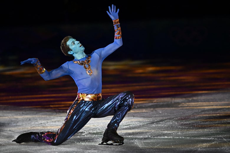 Kvitelashvili kneeling on the ice with his arms raised