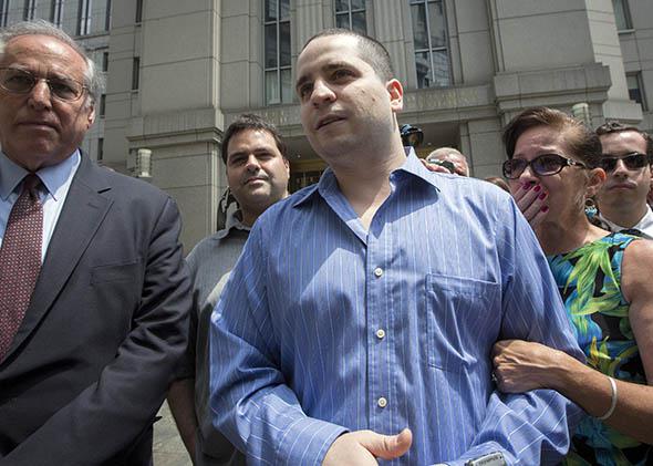 Former New York City police officer Gilberto Valle (C), dubbed by local media as the "Cannibal Cop.